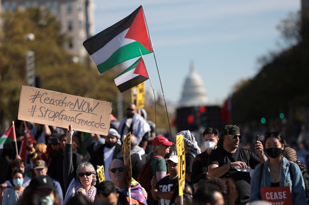 Thousands of protesters in the US capital yesterday called for a ceasefire in Gaza amid Israel’s relentless bombing campaign, with some slamming President Joe Biden’s support for Washington’s top ally in the Middle East. —AFP pic