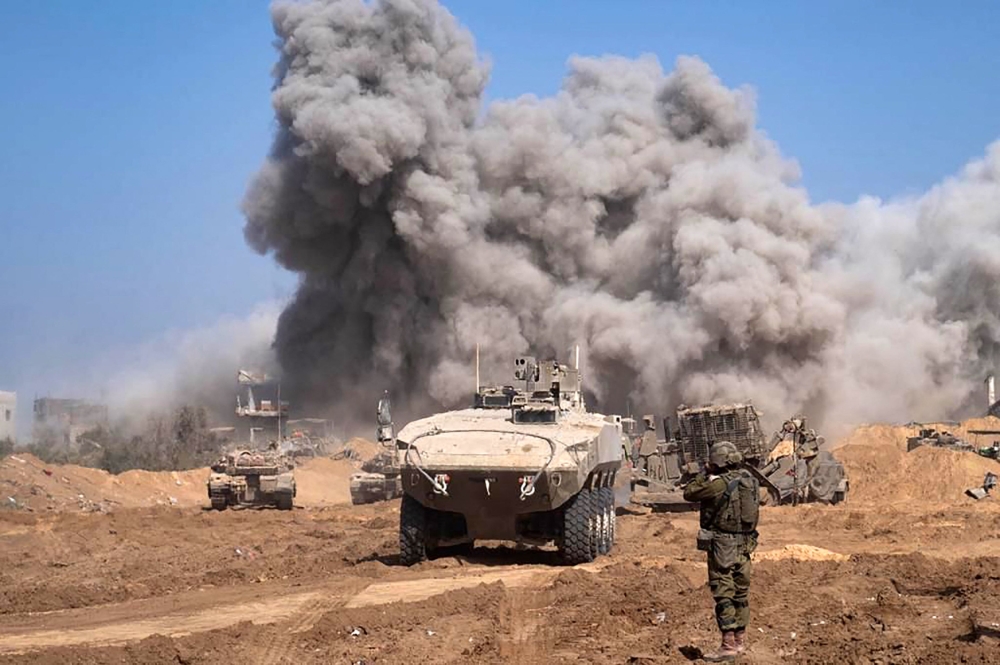 This picture released by the Israeli army on November 5, 2023, shows Israel military vehicles and heavy smoke inside the Gaza Strip as battles between Israel and Hamas continue. — AFP pic/Israeli Army
