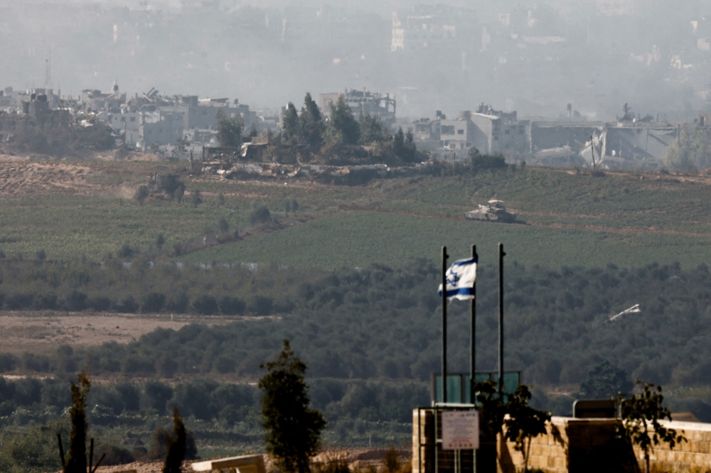 A tank manoeuvres inside Gaza Strip, as seen from the city of Sderot, Israel, November 6, 2023. — Reuters pic