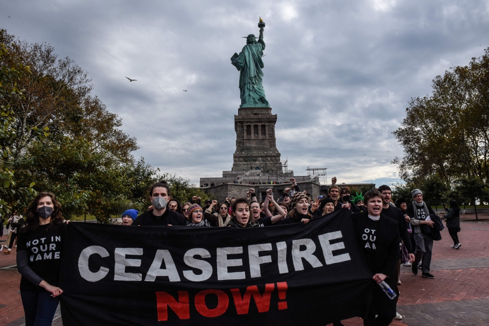 Activists from Jewish Voice for Peace return to the ferry after occupying the pedestal of the Statue of Liberty on November 6, 2023 in New York. ― Stephanie Keith/Getty Images/AFP pic