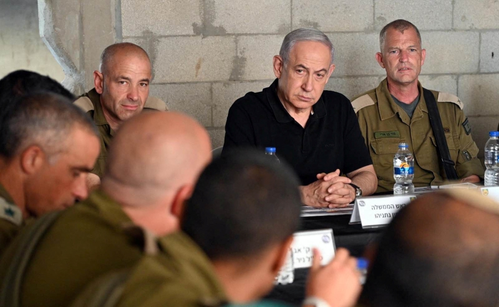 Israeli Prime Minister Benjamin Netanyahu meets with soldiers as he visits an Israeli army base in Tze'elim, Israel November 7, 2023. — Israeli Government Press Office/Haim Zach/Handout via Reuters pic