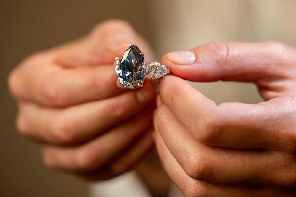 This photograph taken on November 2, 2023 in Geneva, shows ‘Bleu Royal’, a rare 17,61 carats internally flawless fancy vivid blue pear shaped diamond. — AFP pic