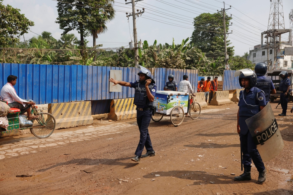 Security forces remain vigilant in front of the garment factories, following clashes between garment industry workers and police over pay, at the Ashulia area, outskirts of Dhaka, Bangladesh, November 8, 2023. — Reuters pic