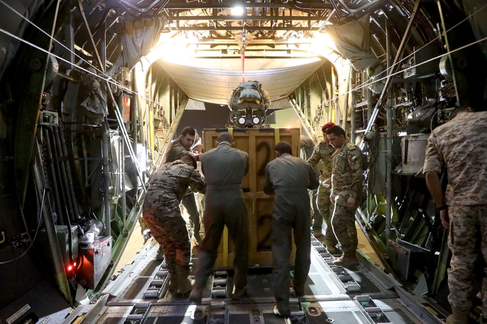 A handout image made available by the Jordanian Armed Forces Media office on November 6, 2023, shows humanitarian aid being loaded into a Jordanian military cargo plane. — AFP pic/Jordanian Armed Forces
