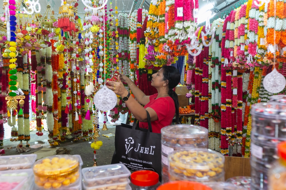 A customer looks at Deepavali decorations in a store in preparation for the upcoming Deepavali festival in Brickfields November 8, 2023. — Picture by Raymond Manuel