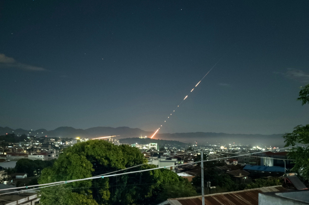 This long exposure picture taken late on October 28, 2023 shows a missile fired from a Myanmar military base in Lashio township, northern Shan State.— AFP pic