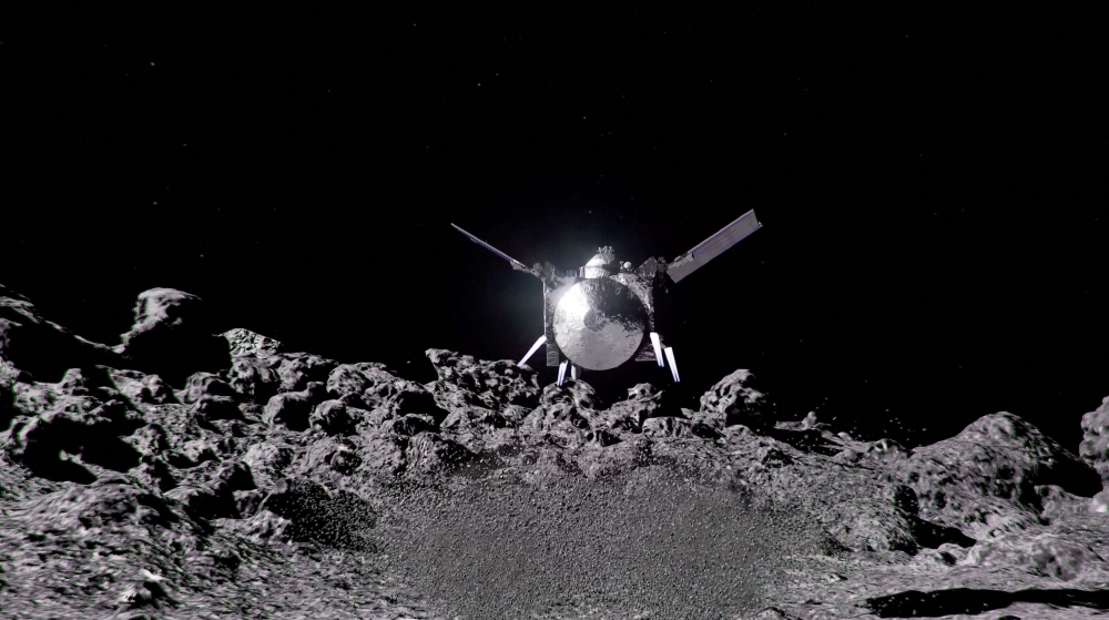 The Nasa spacecraft OSIRIS-APEX hovers over the surface of the near-Earth asteroid Apophis, using its thrusters to disturb the asteroid’s surface to reveal what lies beneath, as shown in an undated Nasa artist’s video rendering, in this screengrab obtained from a handout video. — NASA’s Goddard Space Flight Center handout pic via Reuters 