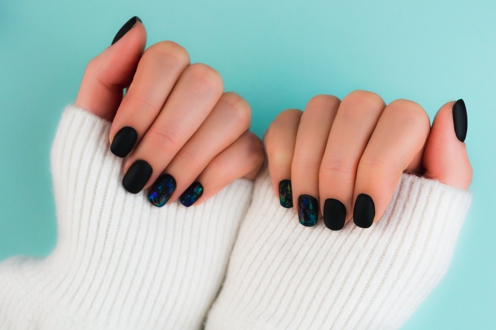 Black nails are said to boost self-confidence and make you feel stronger, according to a new theory gaining ground on TikTok. — ETX Studio pic