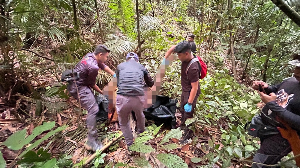 The team found pieces of flesh and body parts, including a leg, about 300 to 500 metres from the site of the first discovery. — Handout by PDRM via Bernama