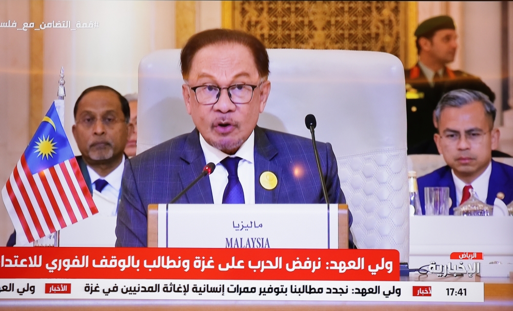 Prime Minister Datuk Seri Anwar Ibrahim addresses the 8th Extraordinary Islamic Summit of the Organisation of Islamic Cooperation (OIC) in Riyadh Saudi Arabia yesterday. — Bernama pic