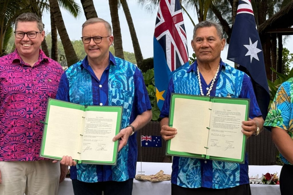 Australian Prime Minister Anthony Albanese and Tuvalu Prime Minister sign a compact between the two nations at the Pacific Resort, Rarotonga, the Cook Islands, November 9, 2023. — AAP Image via Reuters