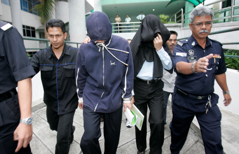 In 2009, Sirul Azhar Umar (second from right) and fellow Special Action Unit commando Azilah Harun (second from left) were sentenced to death for the October 2006 murder of Altantuya in a gruesome case that garnered national interest and fuelled political conspiracy theories that remain popular to this day. — Reuters file pic