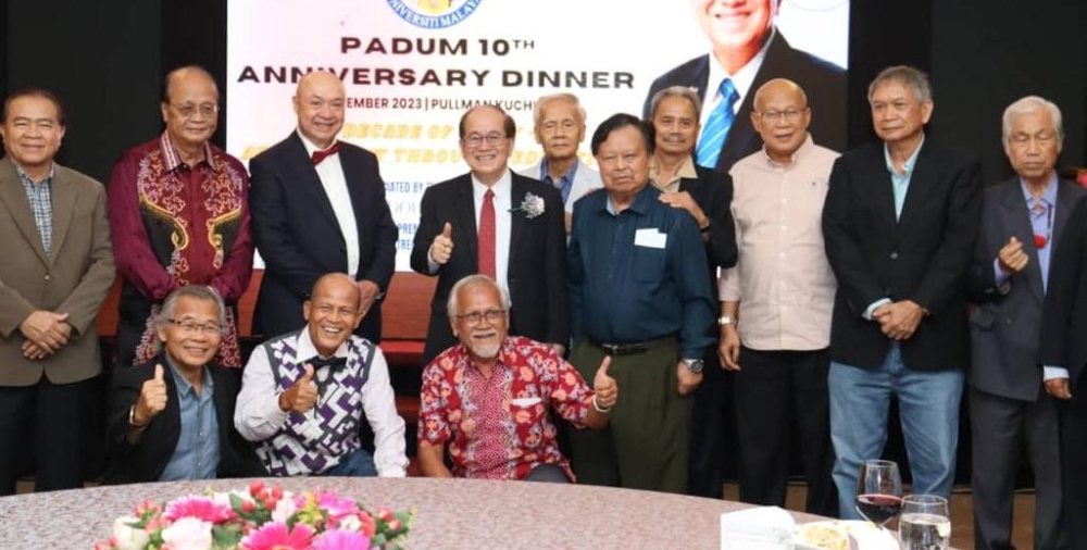 Uggah (fourth from left) joins other senior Padum members in a photo call. — Borneo Post Online pic