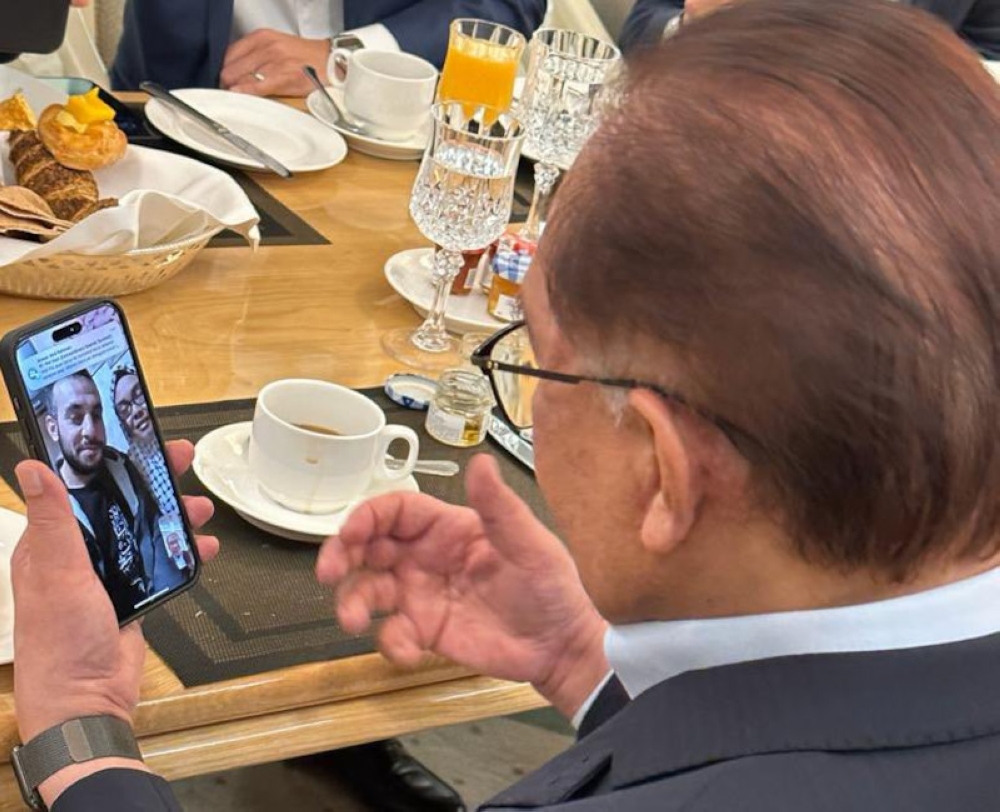 Prime Minister Datuk Seri Anwar Ibrahim in a five-minute video call with Nurul Ain Haron and her Palestinian husband, Mohamed A.M Shaat today, November 13, 2023. — Picture from X/Bernama