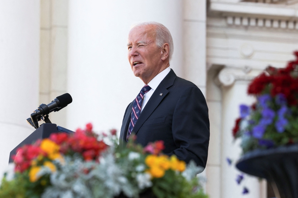 The granddaughter of US President Joe Biden (pictured) was accompanied by security detail who fired on people attempting to break into a Secret Service vehicle. — Reuters pic