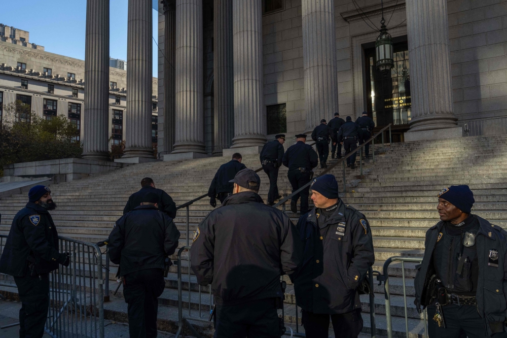 Court officers stand outside of New York State Supreme Court ahead of the Trump Organization civil fraud trial in New York City on November 13, 2023. — AFP pic