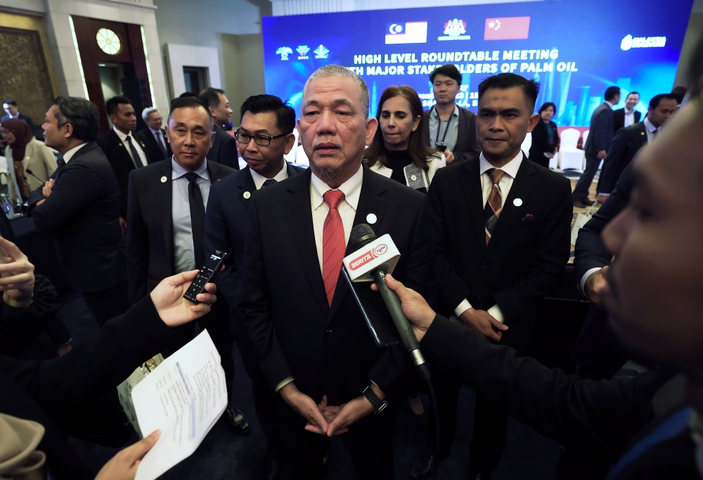 Deputy Prime Minister and Minister of Plantation and Commodities Datuk Seri Fadillah Yusof speaks to the media after a high level roundtable meeting with major stakeholders of palm oil at China Hall Pudong in Shanghai, November 14, 2023. — Bernama pic 