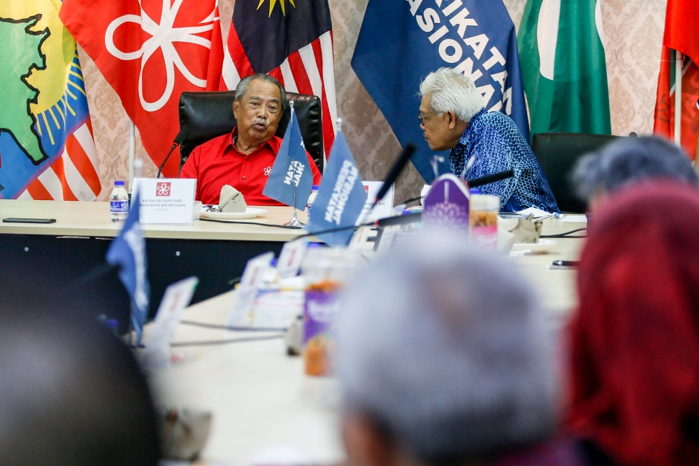 Parti Pribumi Bersatu Malaysia president Tan Sri Muhyiddin Yassin and secretary-general Datuk Seri Hamzah Zainudin at the Perikatan Nasional headquarters for an emergency meeting, November 9, 2023. — Picture by Hari Anggara 