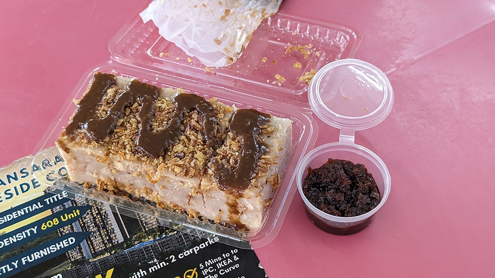 Yam Cake with a squirt of sweet sauce and a delicious 'sambal hae bee' on the side.
