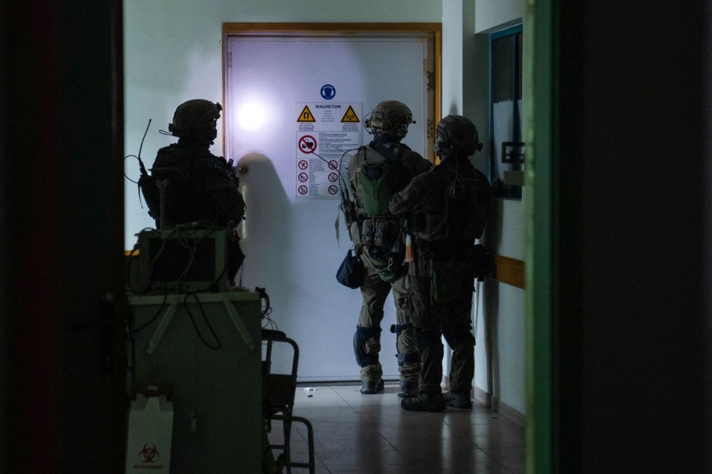 The official said the soldiers were proceeding one building at a time, searching each floor 'in a discrete, methodical and thorough manner, based on ongoing field assessments and informed by questioning taking place in the field'. — Israeli Army photo via AFP