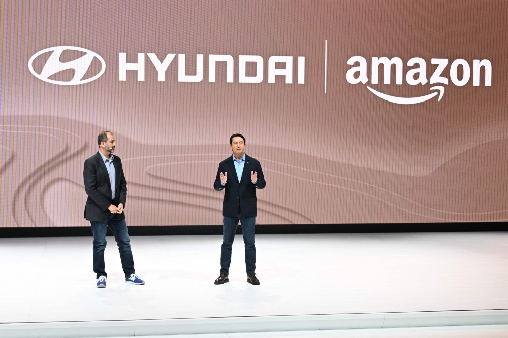 Amazon Vice President of Worldwide Corporate Business Development Marty Mallick (left) and Hyundai Global President and Chief Operating Officer Jose Munoz speak at the Hyundai press conference at Automobility LA in Los Angeles November 16, 2023. ― AFP pic
