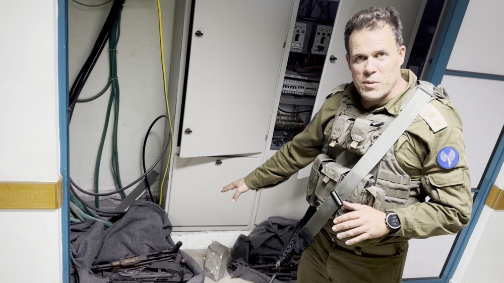 An Israeli officer points at what he describes as weapons discovered at the Al Shifa hospital complex, amid the Israeli military's ground operation against Palestinian Islamist group Hamas, in Gaza City, November 15, 2023 in this still image taken from video. — Picture by Israel Defence Forces/Handout via Reuters
