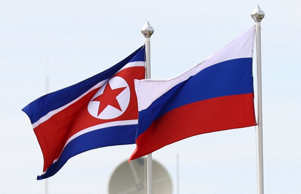 Russian and North Korean flags fluttered at the airport in Pyongyang as high-level North Korean officials saw the delegation off, KCNA said. — File picture by Sputnik/Artem Geodakyan/Pool via Reuters