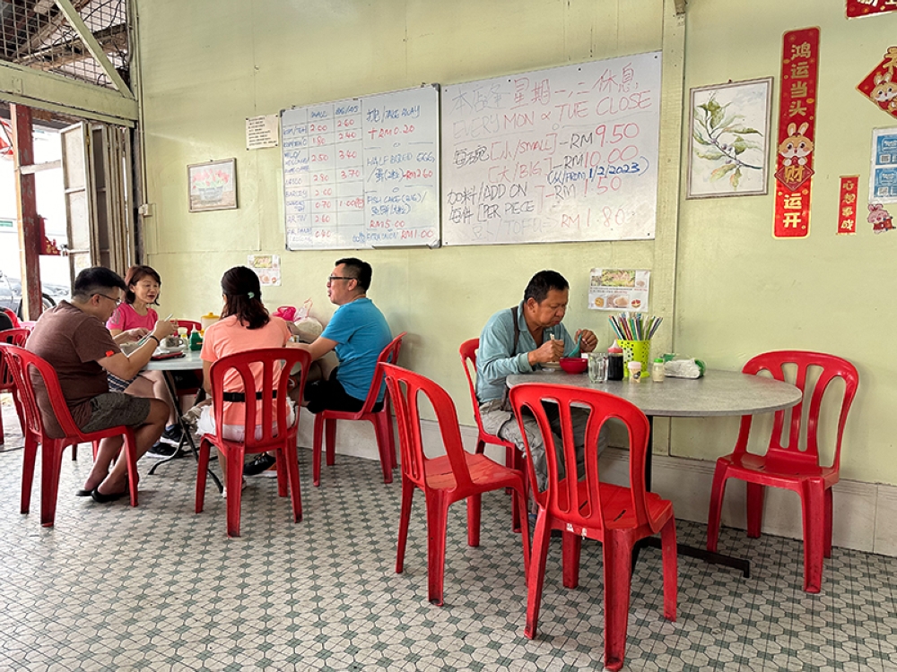 Regulars drop by for a fortifying breakfast of fish ball noodles