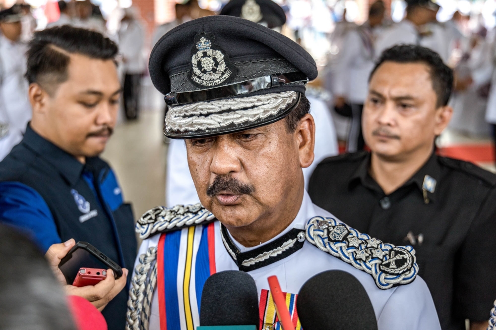 Inspector-General of Police Tan Sri Razarudin Husain speaks to reporters at the Kuala Lumpur Police Training Centre (Pulapol), November 16, 2023. — Picture by Firdaus Latif