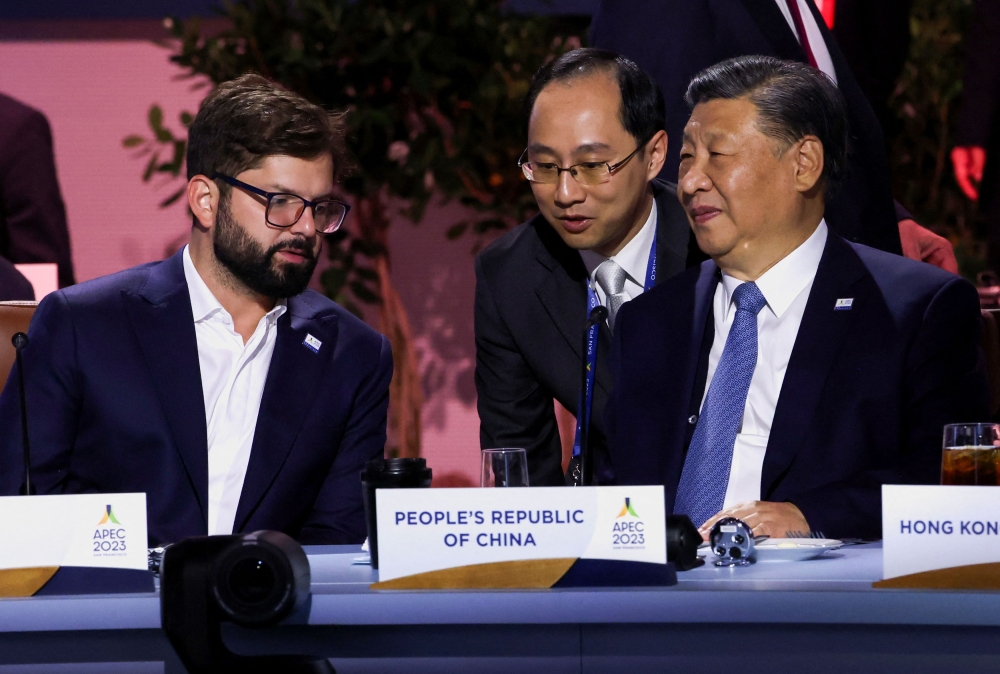 Chinese President Xi Jinping speaks with Chile's President Gabriel Boric during the Asia-Pacific Economic Cooperation (Apec) Summit in San Francisco November 16, 2023. — Reuters pic