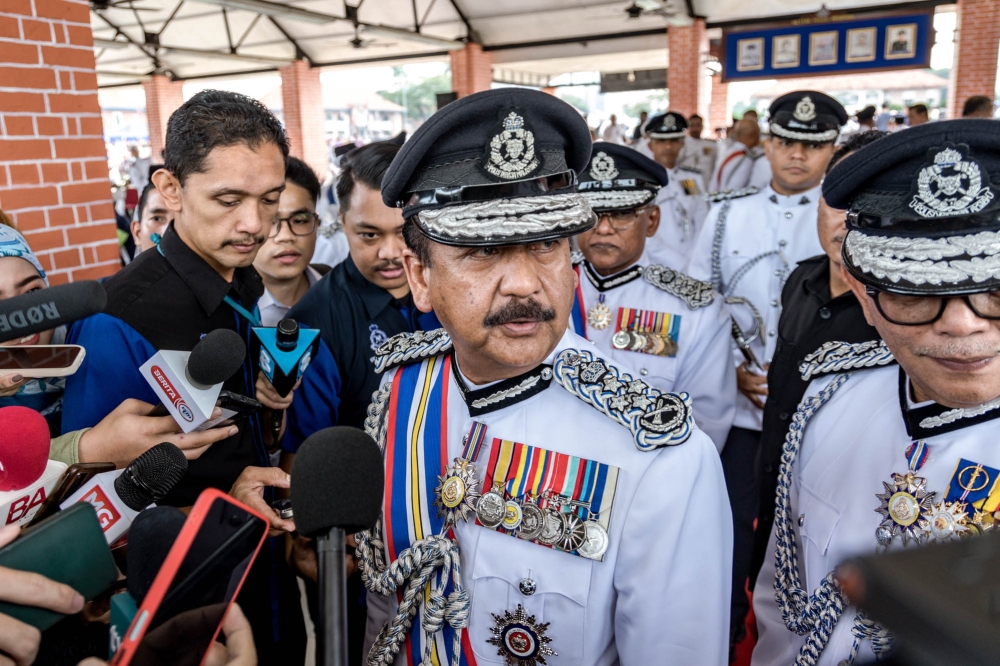 Inspector-General of Police Tan Sri Razarudin Husain speaks to reporters at the Kuala Lumpur Police Training Centre (Pulapol), November 16, 2023. — Picture by Firdaus Latif