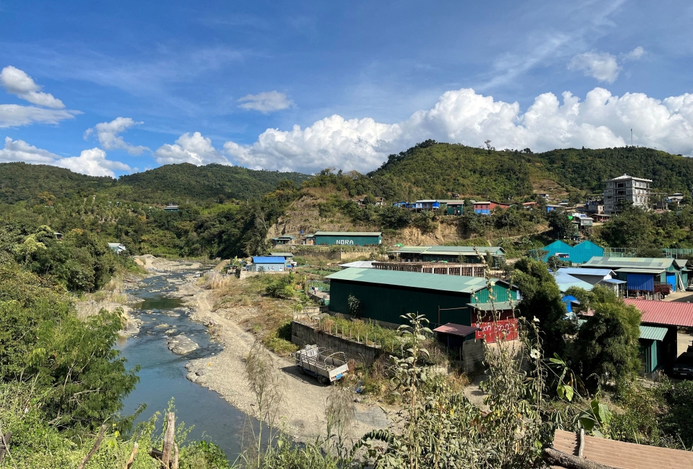 A view of Myanmar's Khawmawi village on the India-Myanmar border across the Tiau river as seen from Zokhawthar village in Champhai district of India's northeastern state of Mizoram, India November 14, 2023. — Reuters pic
