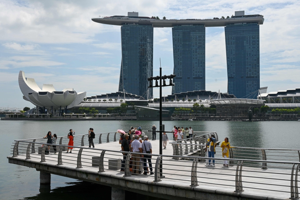 Singapore and Indonesia launched cross-border payment services today, the countries’ central banks said, as part of a regional drive to boost connectivity. — AFP pic