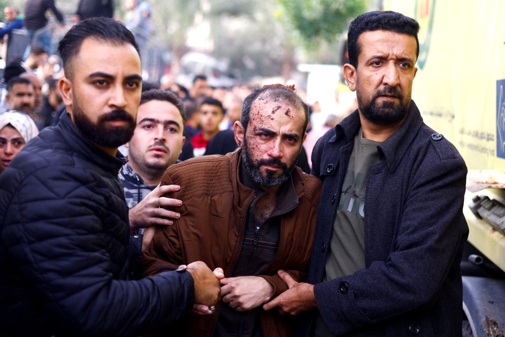 A Palestinian man wounded in an Israeli strike is rushed into Nasser hospital, amid the ongoing conflict between Israel and Palestinian Islamist group Hamas, in Khan Younis in the southern Gaza Strip November 19, 2023. — Reuters pic