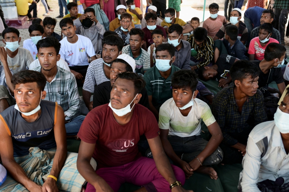 Rohingya Muslim men rest, as they arrive in Kulee village, Pidie regency, Aceh province, Indonesia, November 19, 2023. — Reuters pic
