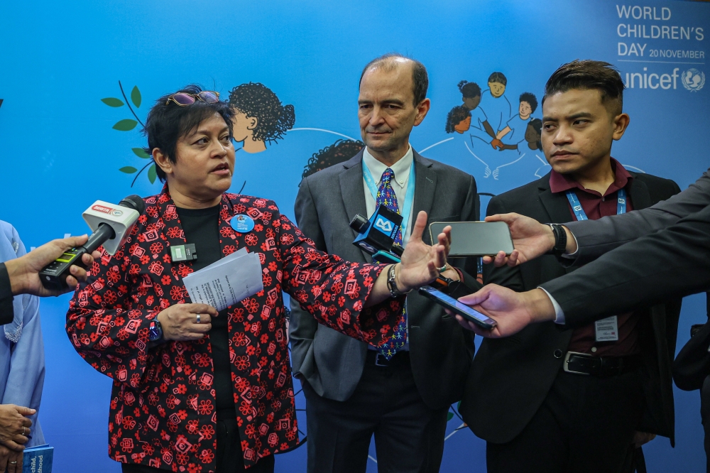 The Minister in the Prime Minister’s Department Datuk Seri Azalina Othman Said speaks to the media after visiting the World Children’s Day booth setup by the United Nations Children’s Fund (Unicef) at the Parliament building. — Bernama pic