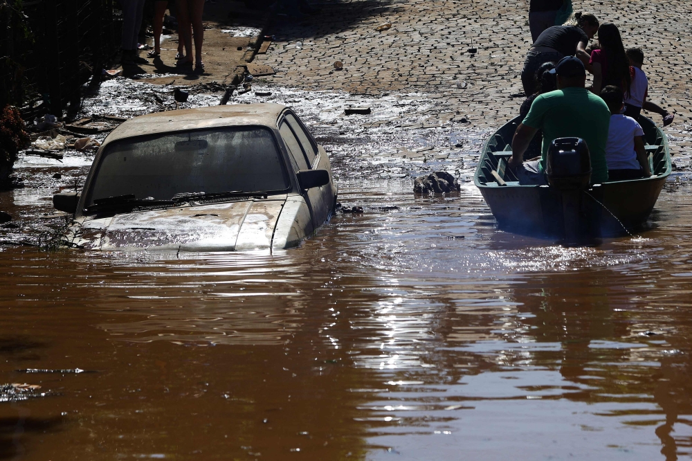 Flooding and landslides triggered by heavy rains in southern Brazil have claimed at least six lives over the past week. — AFP pic
