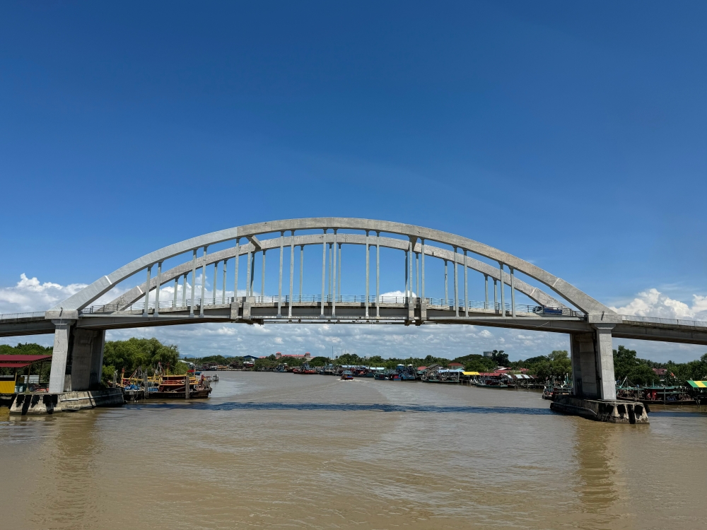 The brown waters of Sungai Kedah as seen from the Kuala Kedah town cargo jetty. — Picture by Josie Thong