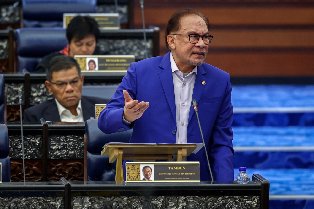 Prime Minister Datuk Seri Anwar Ibrahim speaks at the Parliament in Kuala Lumpur November 21, 2023. — Bernama pic