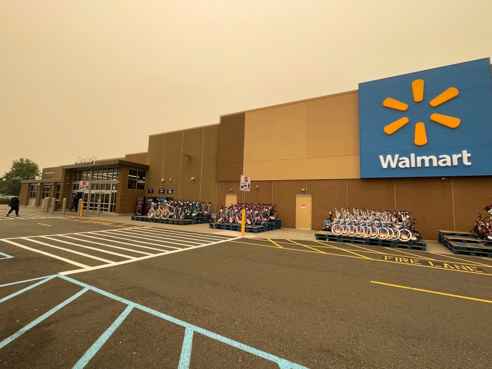 At least one person was killed and three people were injured yesterday in a shooting at a Walmart store in Beavercreek, Ohio, WHIO television reported, citing its reporters on the scene, as witnesses told media a man opened fire with an assault rifle. — Reuters pic