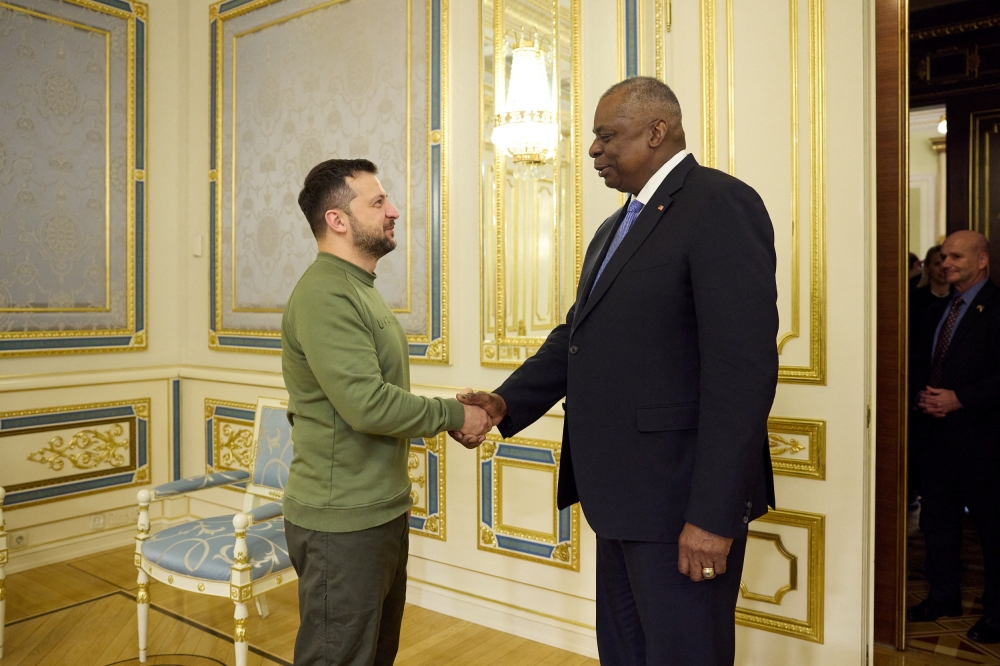 Ukraine’s President Volodymyr Zelenskiy welcomes US Defence Secretary Lloyd Austin before their meeting. — Reuters pic/Ukrainian Presidential Press Service