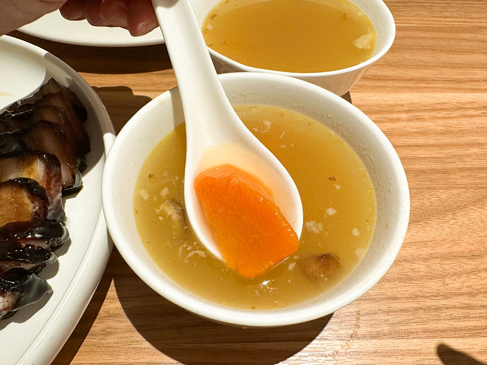 A bowl of well-prepared soup with peppery flavours is served with each order of food.