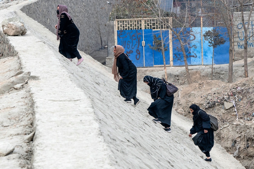 The Taliban have stopped most Afghan female staff from working at aid agencies, closed beauty salons, barred women from parks and curtailed travel for women in the absence of a male guardian. — AFP pic