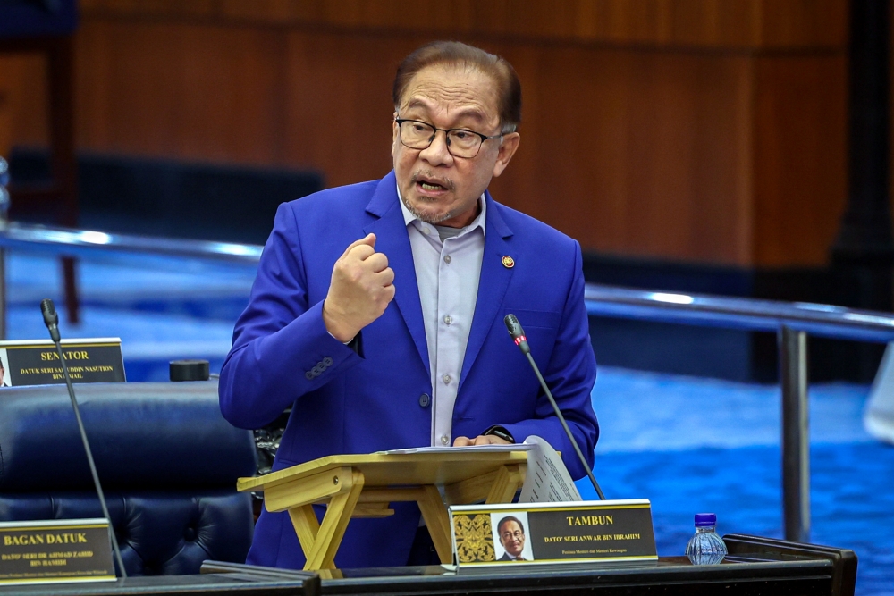 Prime Minister Datuk Seri Anwar Ibrahim speaks at the Parliament in Kuala Lumpur November 22, 2023. — Bernama pic