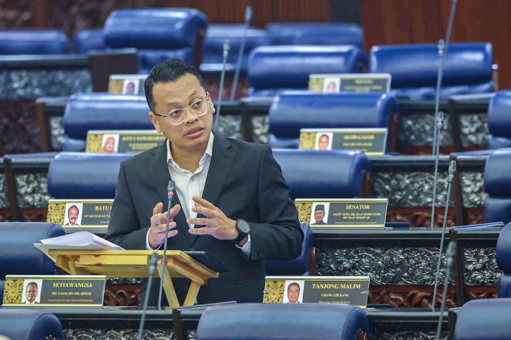 Natural Resources, Environment and Climate Change Minister Nik Nazmi Nik Ahmad speaks at the Parliament in Kuala Lumpur November 22, 2023. — Bernama pic
