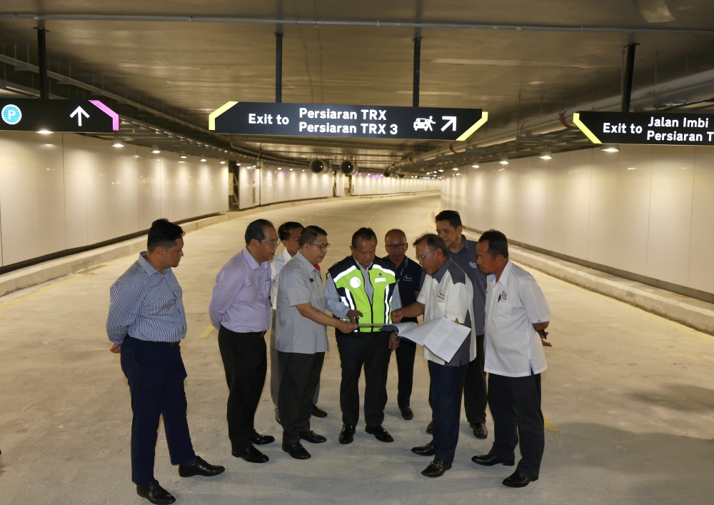 Works Minister Datuk Seri Alexander Nanta Linggi surveys the infrastructure works around the Tun Razak Exchange tunnel, November 22, 2023. — Bernama pic   