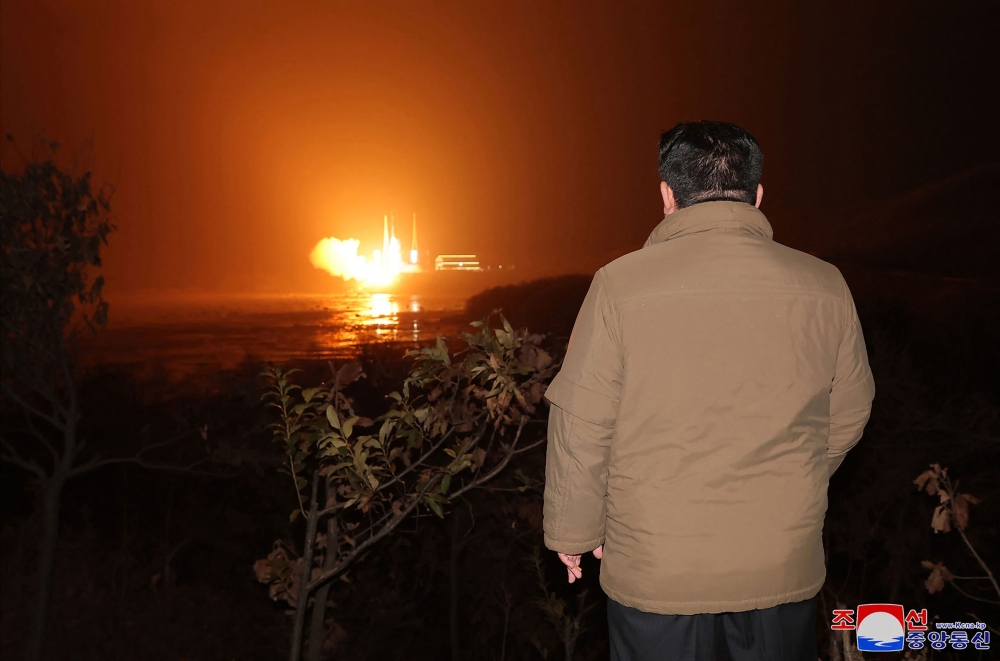 This picture taken on November 21, 2023 and released from North Korea’s official Korean Central News Agency (KCNA) on November 22, 2023 shows North Korea’s leader Kim Jong-un inspecting the launch of a rocket carrying the reconnaissance satellite ‘Malligyong-1’ from the Sohae Satellite Launch Site in North Phyongan province. — AFP pic/KCNA via KNS