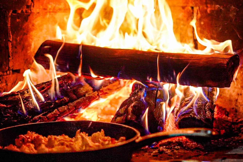 Food cooked in a wood fire oven has a unique taste and aroma.