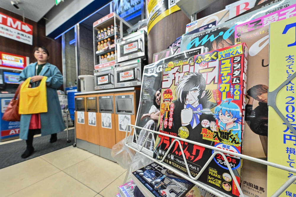This photo illustration shows a magazine rack with the newest instalment of a hugely successful Japanese manga series 