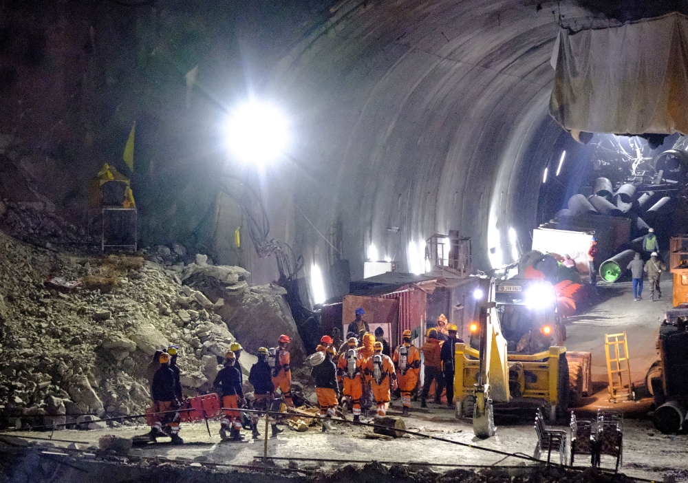 Rescuers in India are set to work through today drilling through debris to reach 41 men trapped in a highway tunnel in the Himalayan region after removing a metal obstruction that slowed progress overnight, a top official said. — Reuters pic
